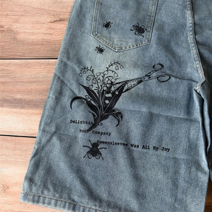 Incredible baggy wide leg denim shorts jorts with graffiti/graphic in light blue.