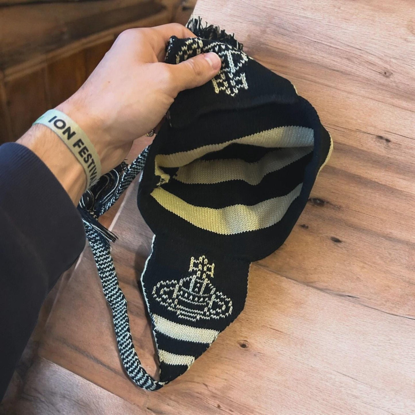Lovely vintage style Dappy ear flap bobble hat in black/beige stripes. One size.