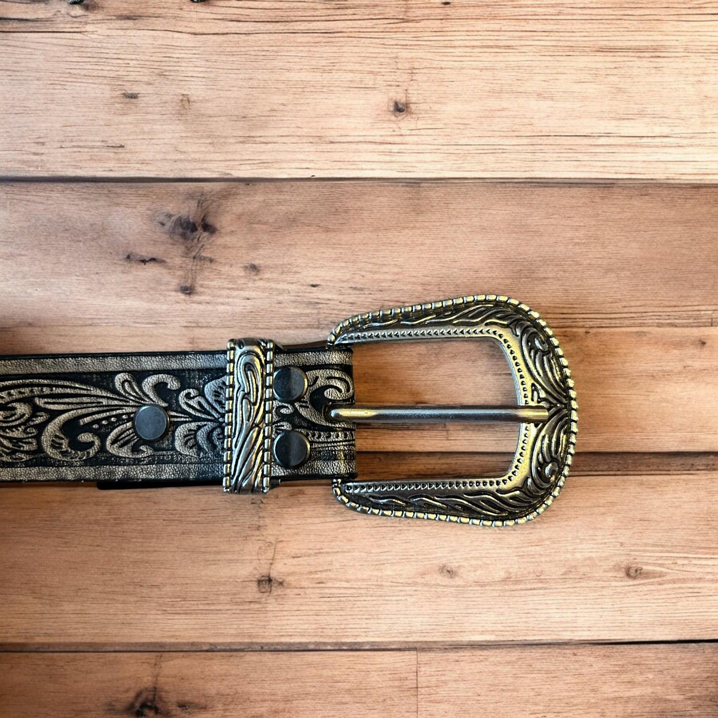 Vintage style faux leather western cowboy gothic belt in black with silver trim.