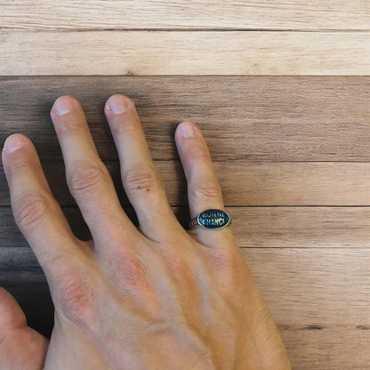 Vintage style stainless steel Bonne Chance ring in silver/ blue. One size.