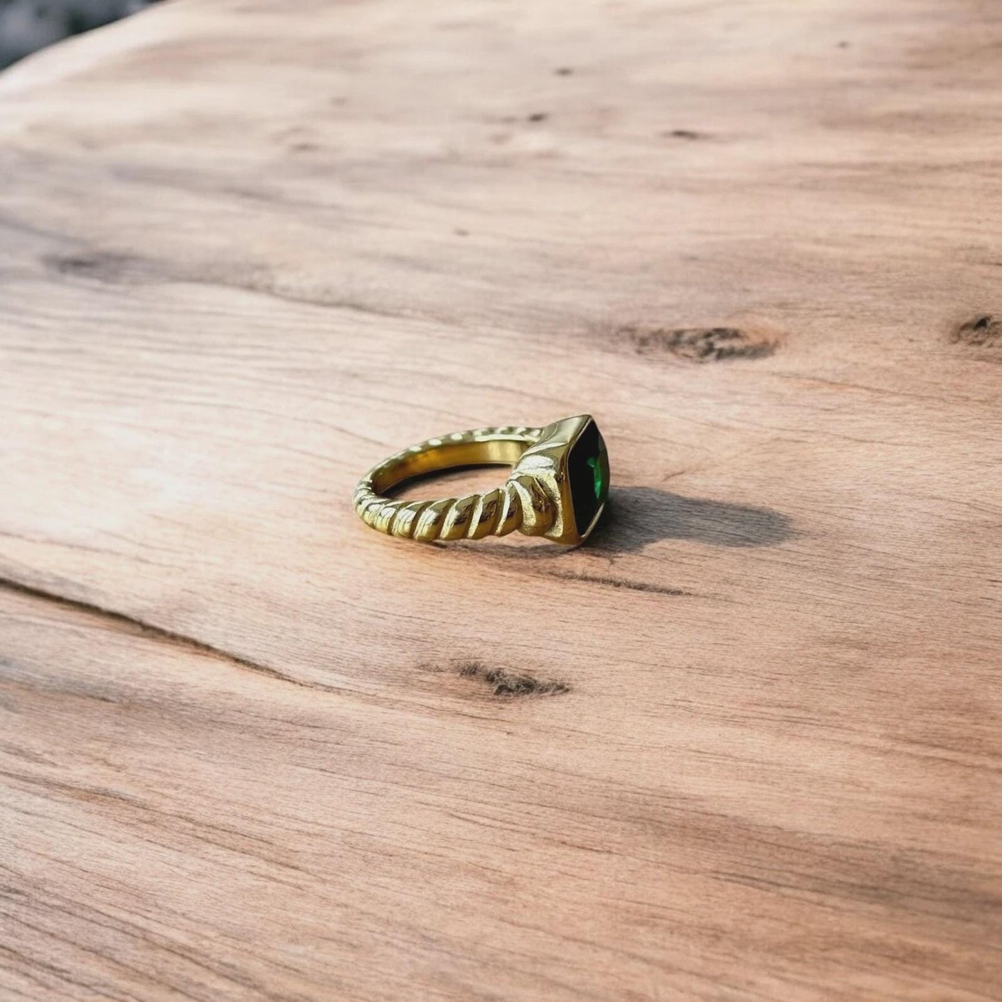 Lovely vintage style gold ring with green gemstone.