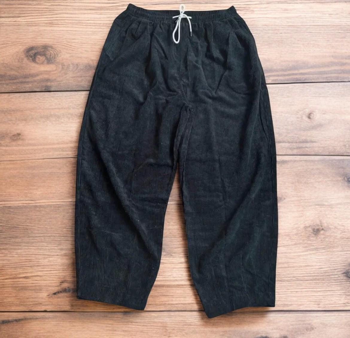 Super baggy wide leg skater corduroy trousers in black.