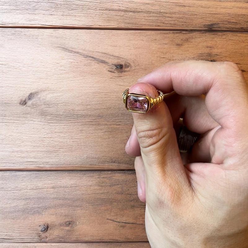 Lovely vintage style gold ring with pink gemstone. All sizes.