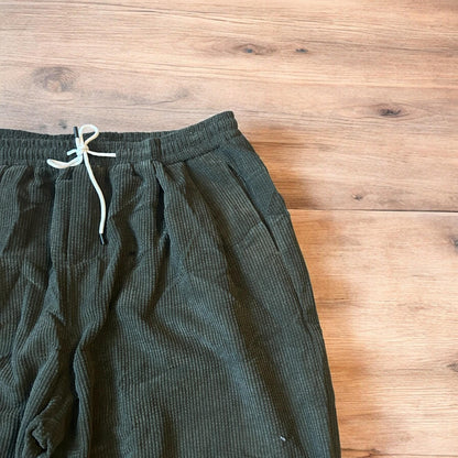 Super baggy wide leg skater corduroy trousers in khaki green.