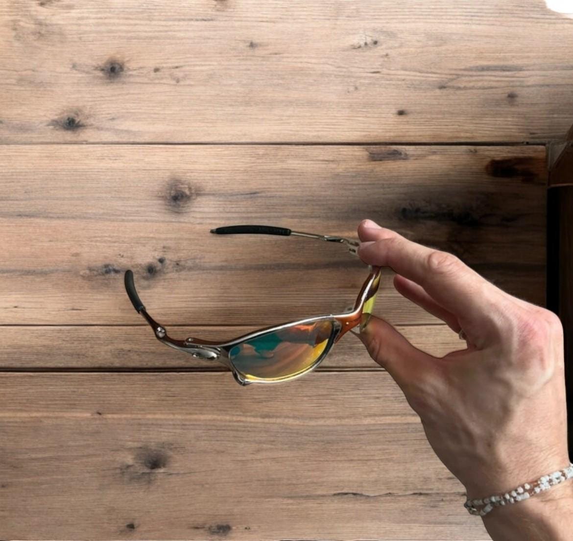 Insane metal frame sunglasses in silver with orange lense. One size.