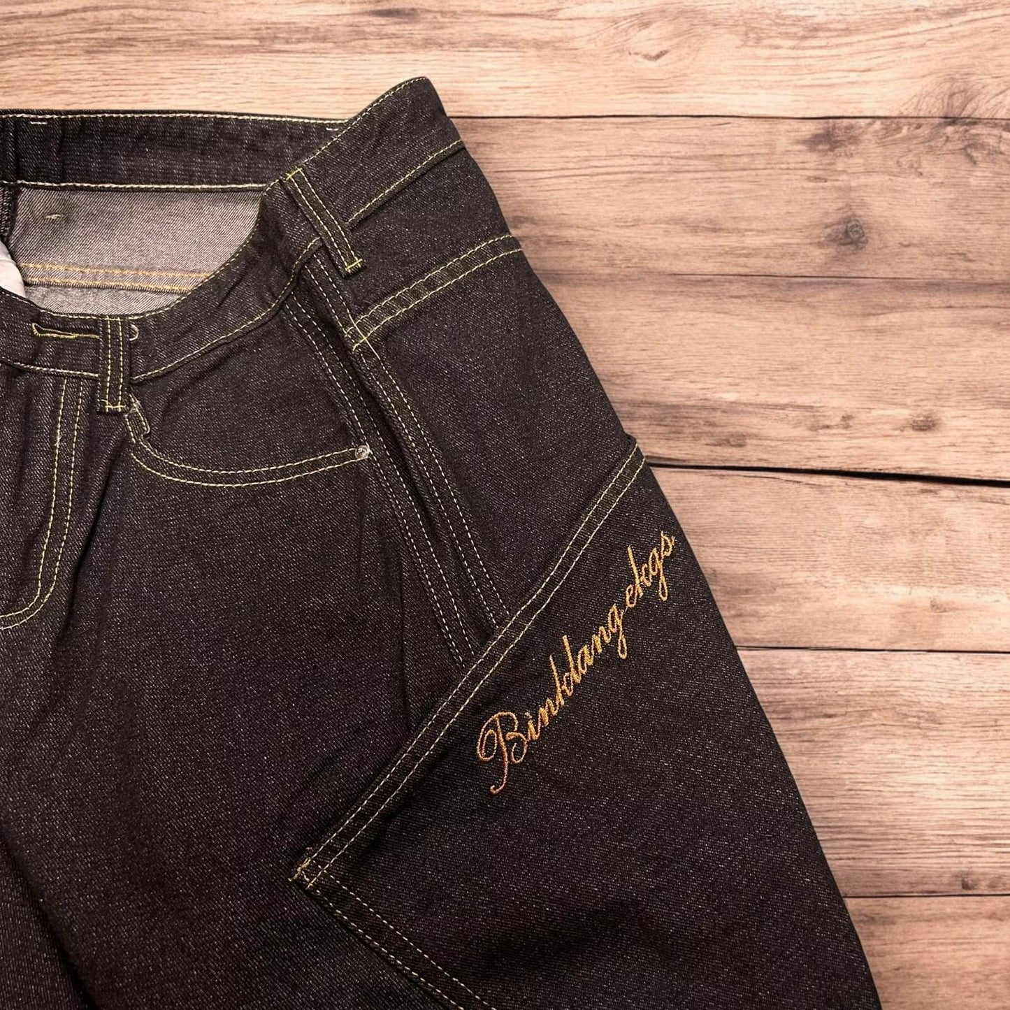 Incredible vintage style baggy wide leg skater fit jeans with embroidery in mid black.
