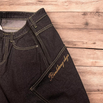 Incredible vintage style baggy wide leg skater fit jeans with embroidery in mid black.