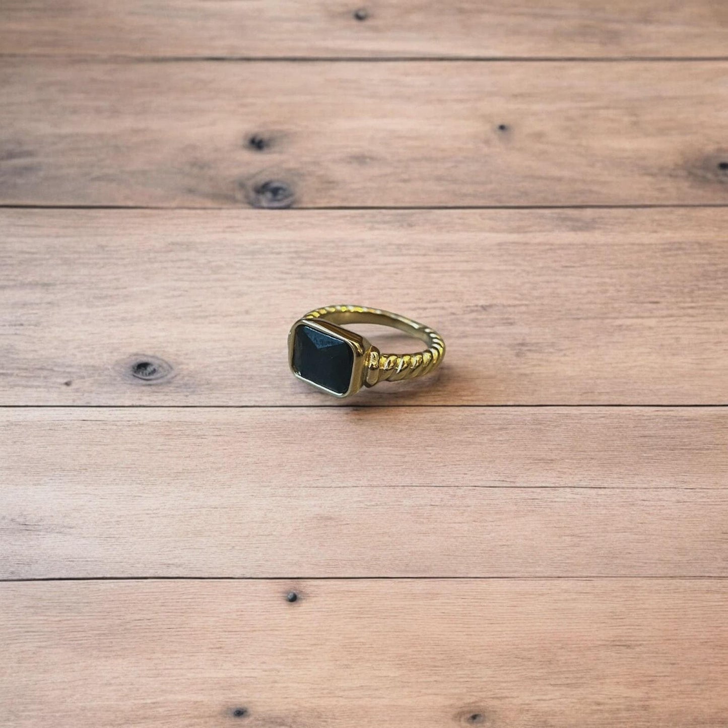 Lovely vintage style gold ring with black gemstone.