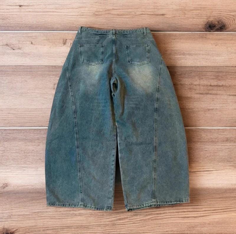 Incredible vintage style baggy wide leg skater fit jeans with fade in light blue.
