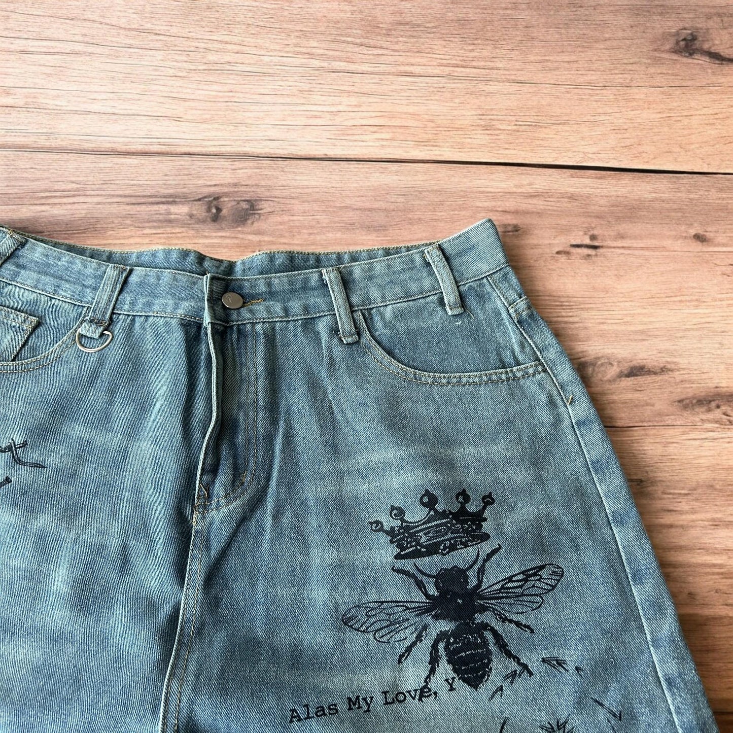 Incredible baggy wide leg denim shorts jorts with graffiti/graphic in light blue.