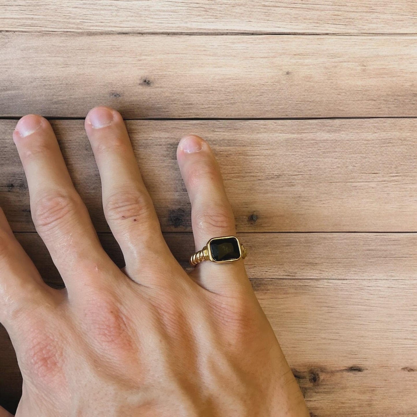 Lovely vintage style gold ring with black gemstone.