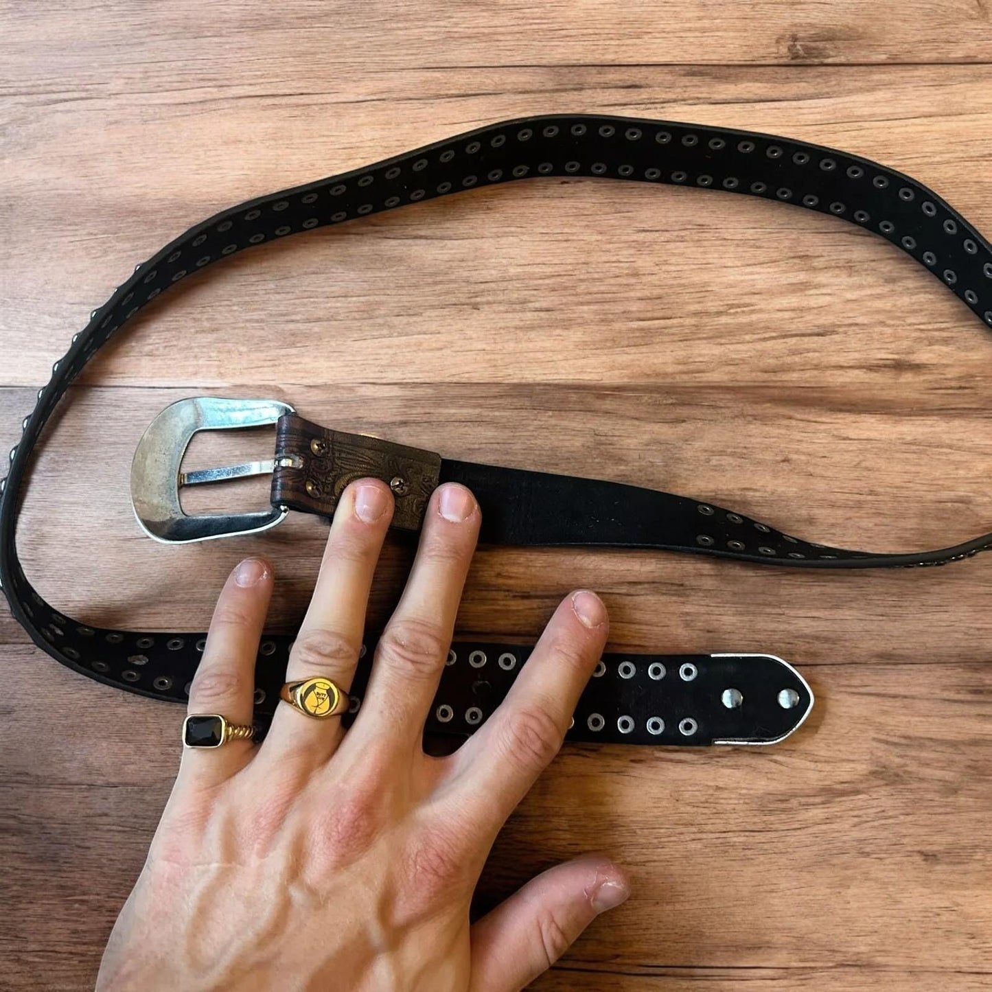 Vintage style faux leather western cowboy gothic belt in brown with silver trim.