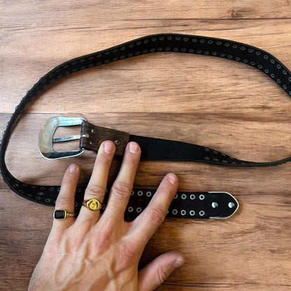 Vintage style faux leather western cowboy gothic belt in brown with silver trim.