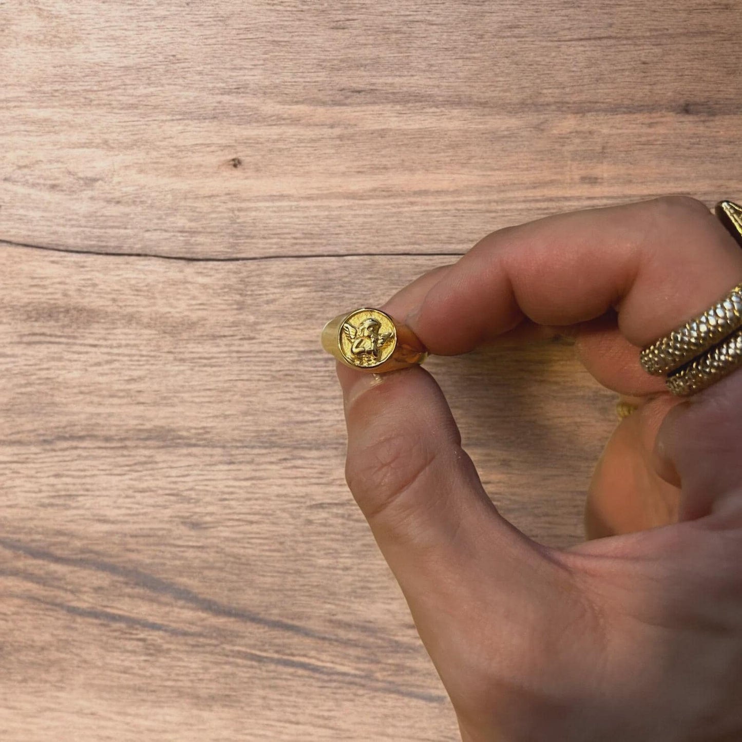 Lovely vintage style stainless steel angel signet ring in gold.