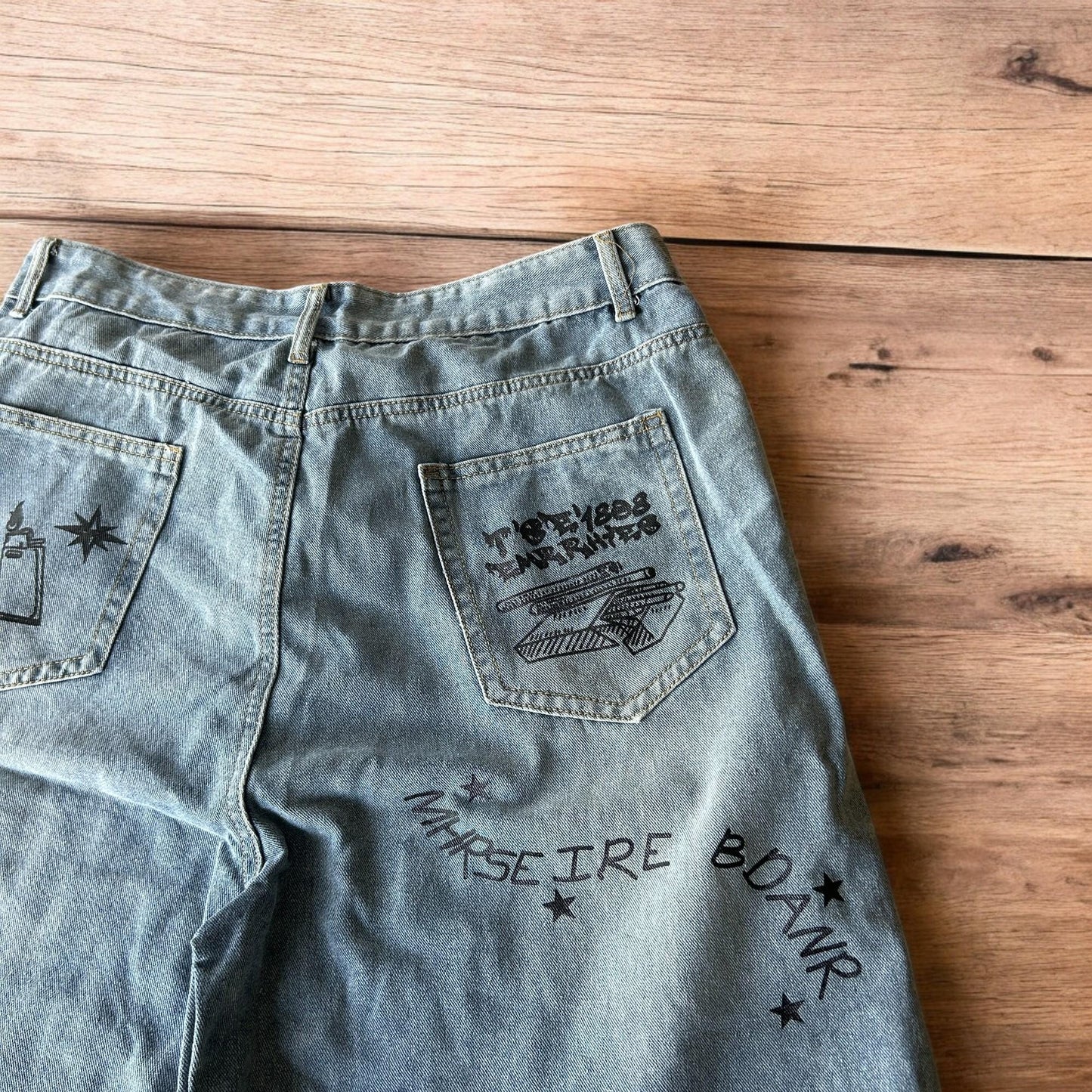 Incredible baggy wide leg denim shorts jorts with graffiti/graphic in light blue.