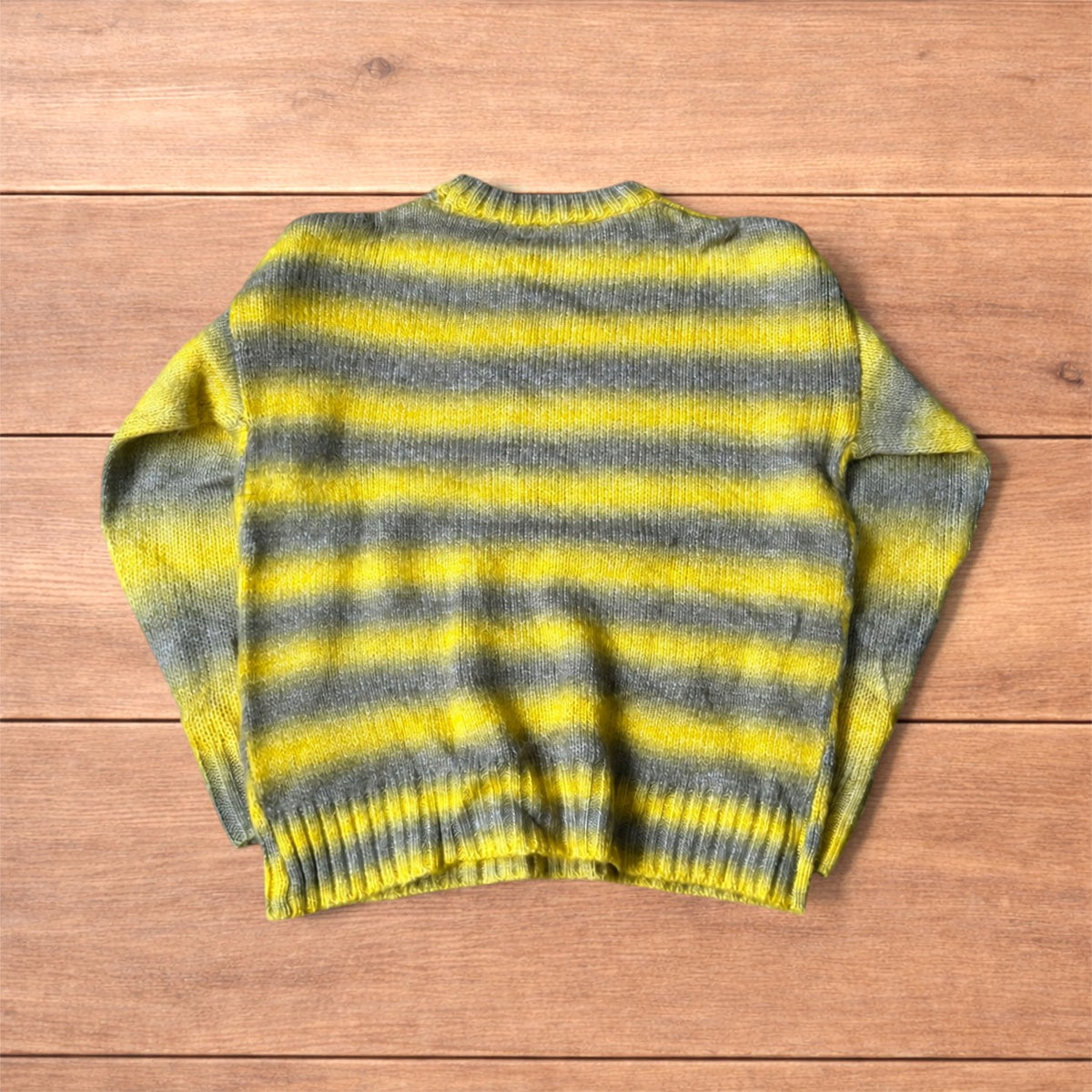 Vintage style striped knitted sweater jumper in yellow and grey.