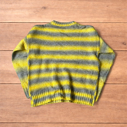 Vintage style striped knitted sweater jumper in yellow and grey.