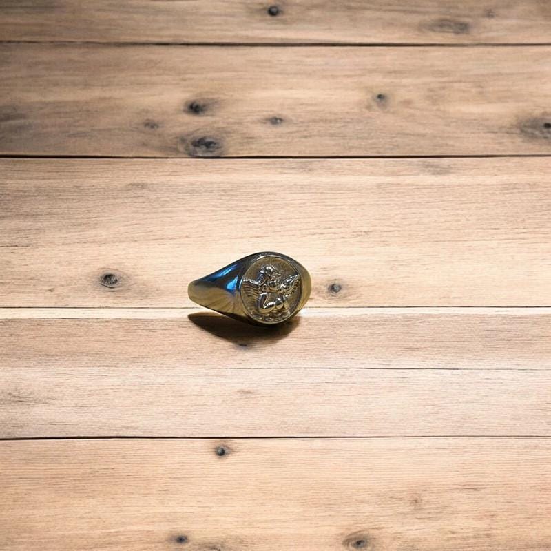 Lovely vintage style stainless steel angel signet ring in silver.