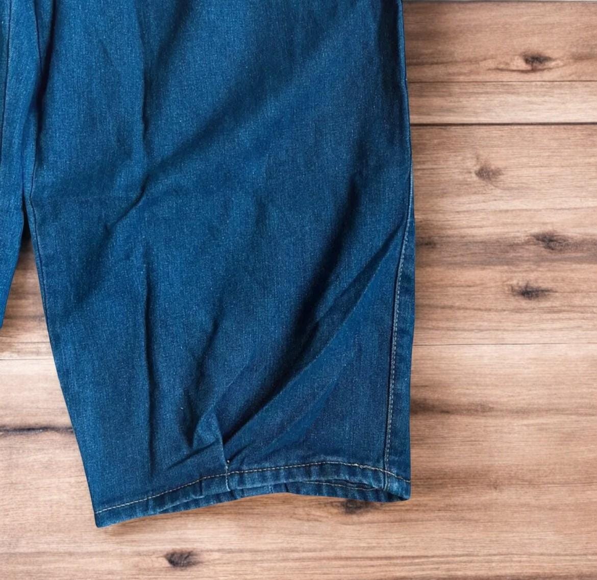Vintage style baggy wide leg skater fit jeans in washed mid blue.