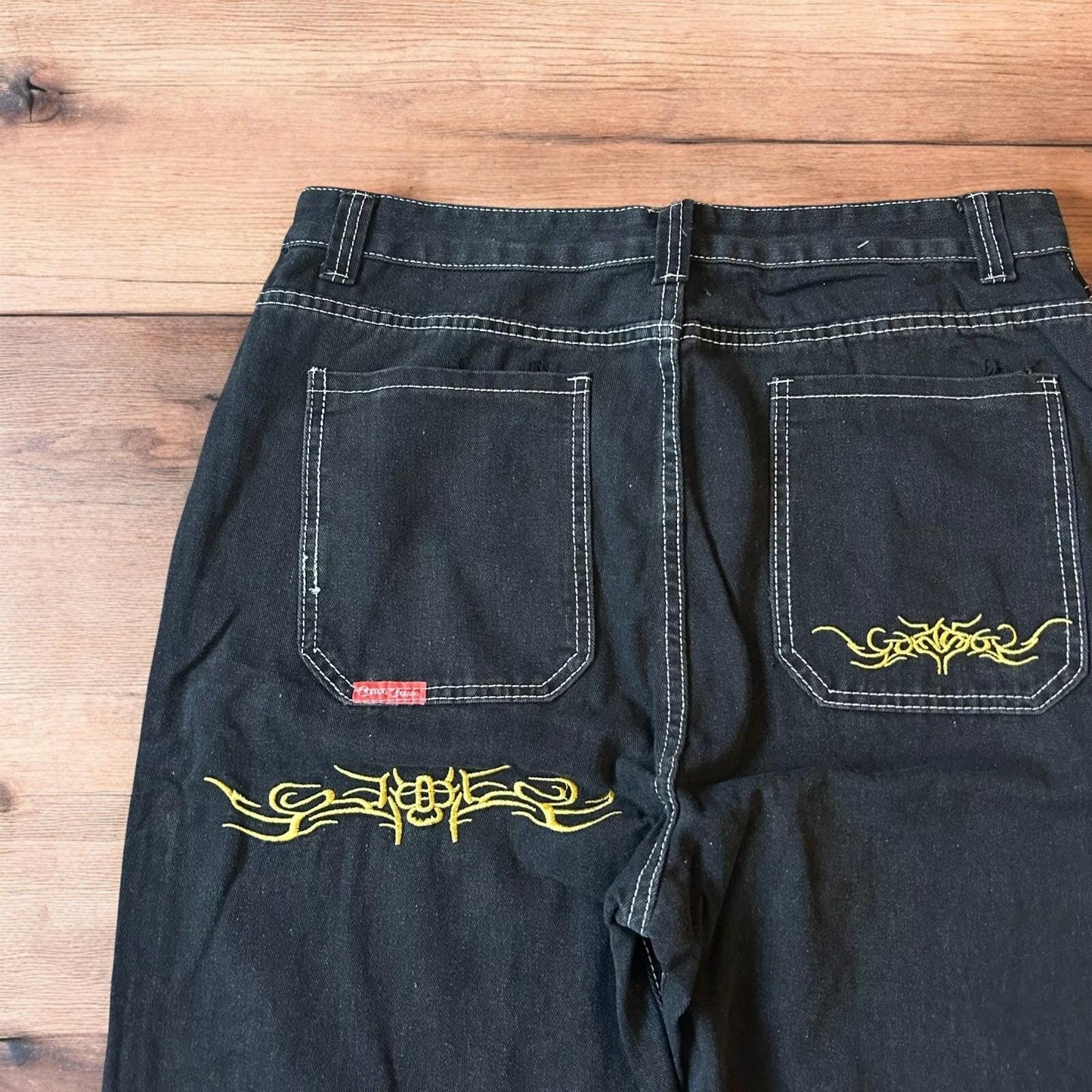 Insane baggy relaxed fit jeans in washed black with embroidery.