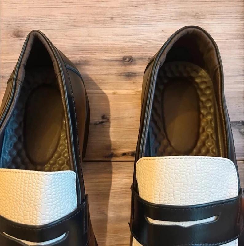 Lovely classic style loafers shoes in black and white design.