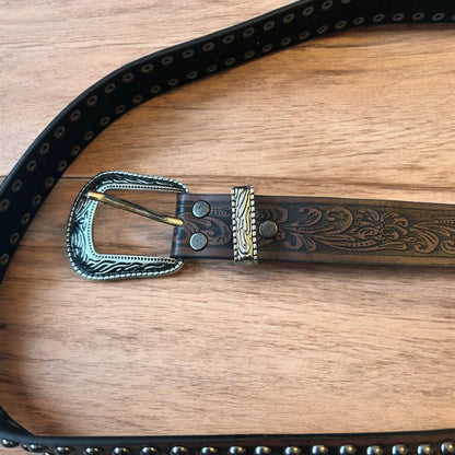 Vintage style faux leather western cowboy gothic belt in brown with silver trim.