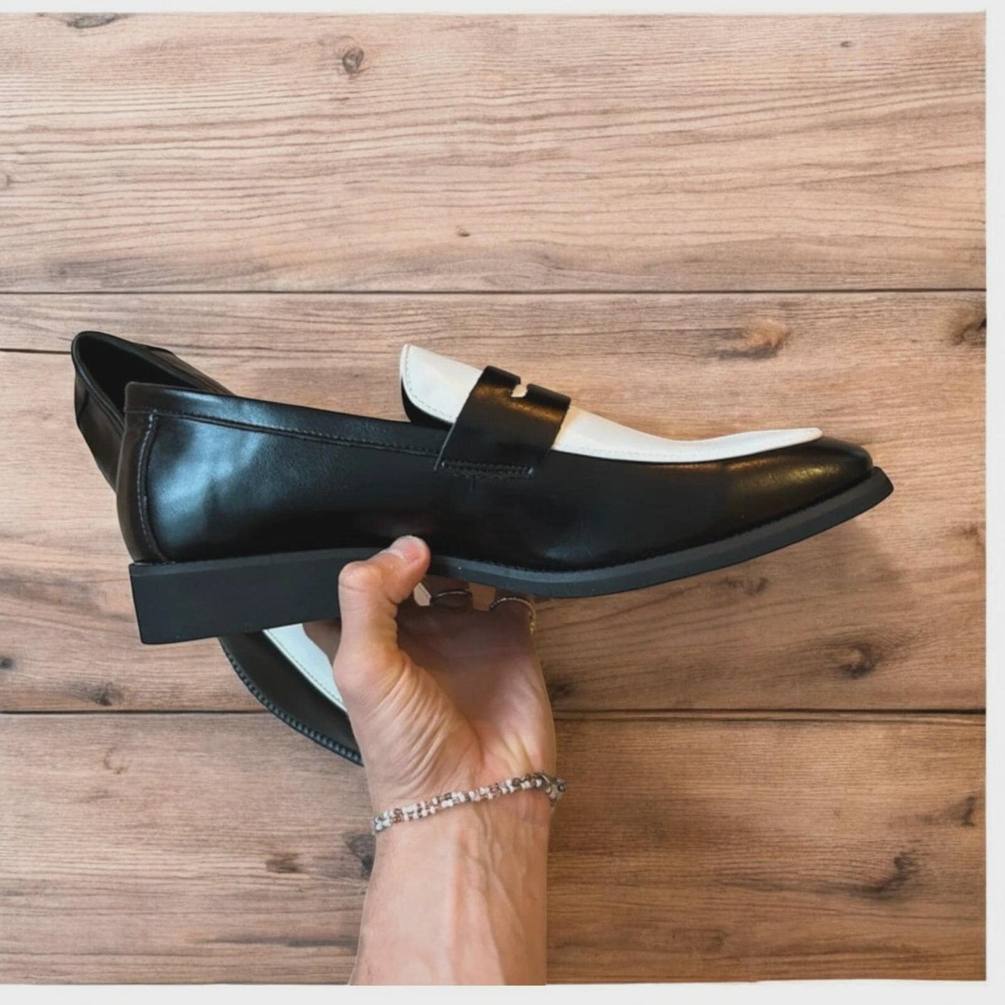 Lovely classic style penny loafers shoes in black and white design.