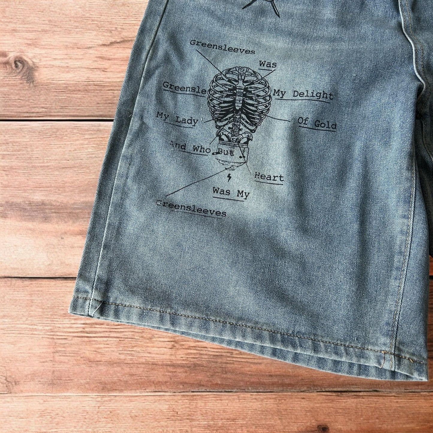 Incredible baggy wide leg denim shorts jorts with graffiti/graphic in light blue.