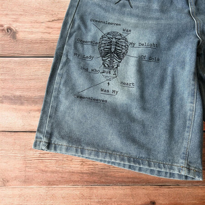 Incredible baggy wide leg denim shorts jorts with graffiti/graphic in light blue.