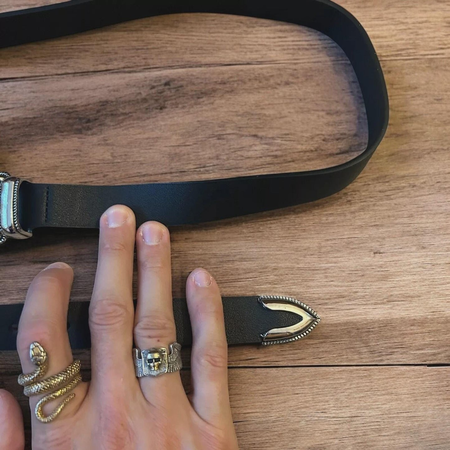 Vintage style faux leather western cowboy belt in black with silver trim. 100cm.
