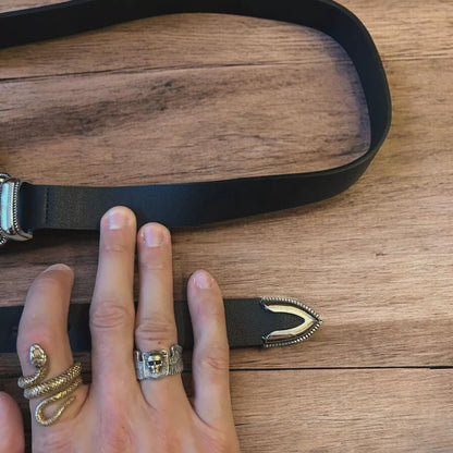 Vintage style faux leather western cowboy belt in black with silver trim. 100cm.