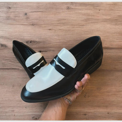 Lovely classic style penny loafers shoes in black and white design.