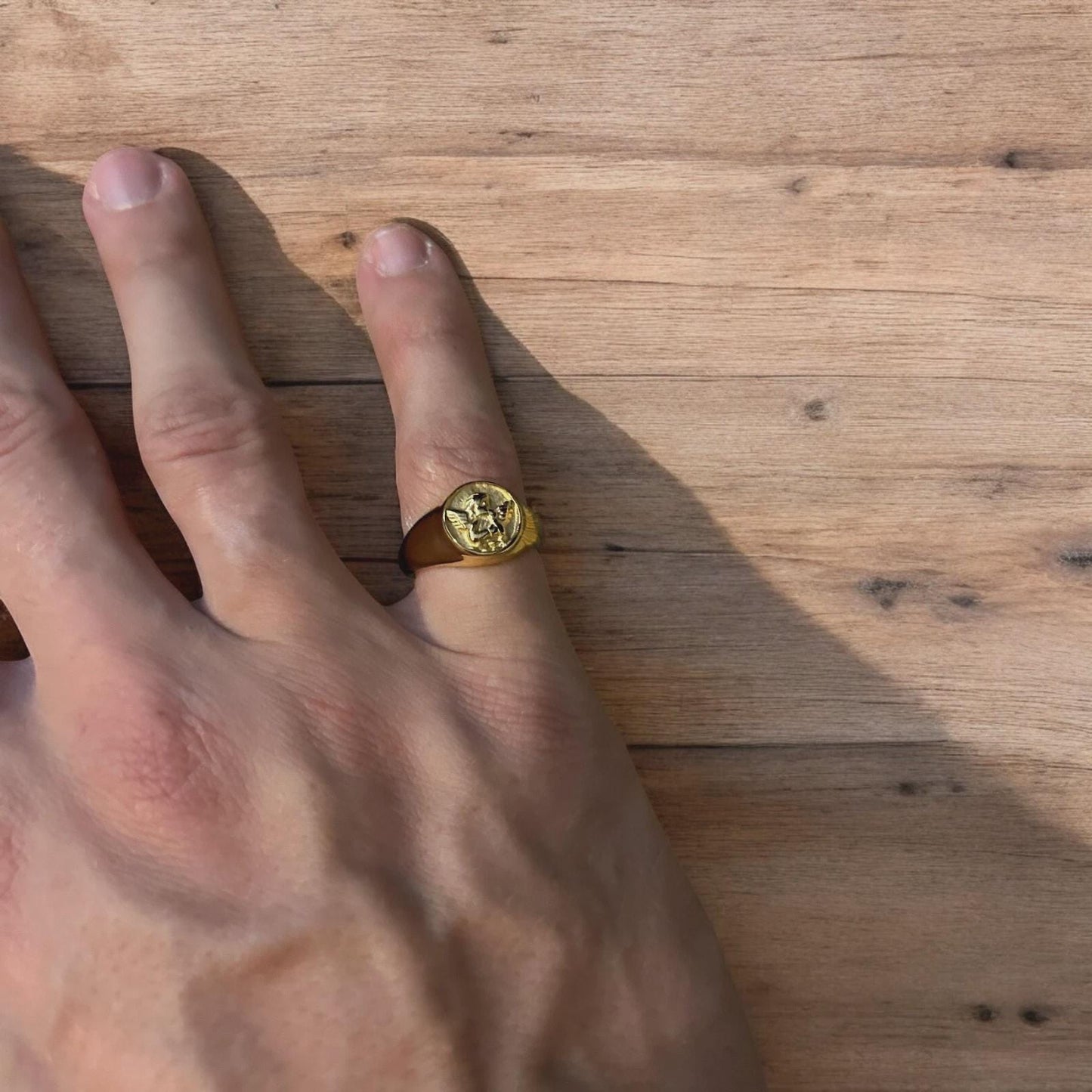 Lovely vintage style stainless steel angel signet ring in gold.