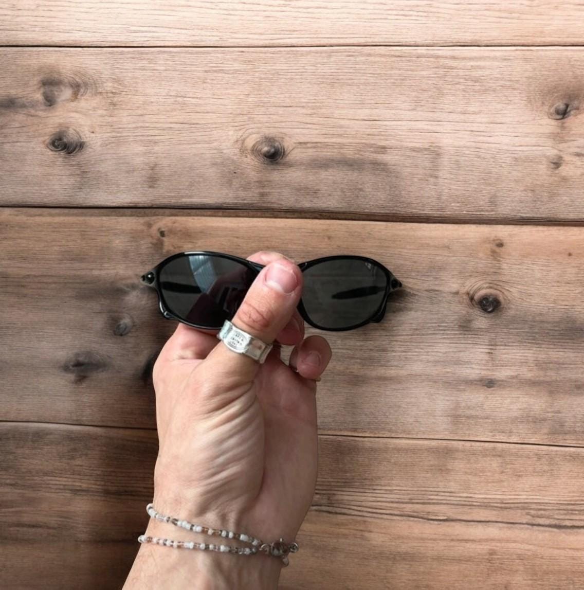 Insane metal frame sunglasses in black with black lense. One size.