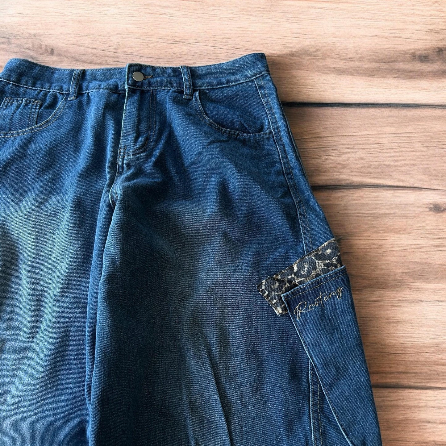 Incredible vintage style baggy wide leg skater fit jeans with leopard print in mid blue.