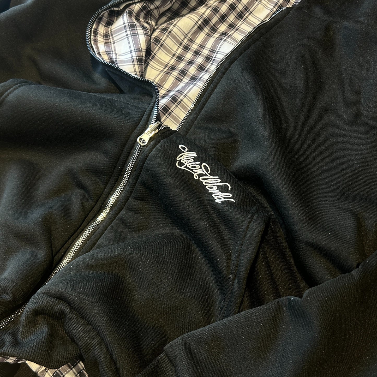 Oversized baggy reversible zip up hoodie jumper in checkered black.