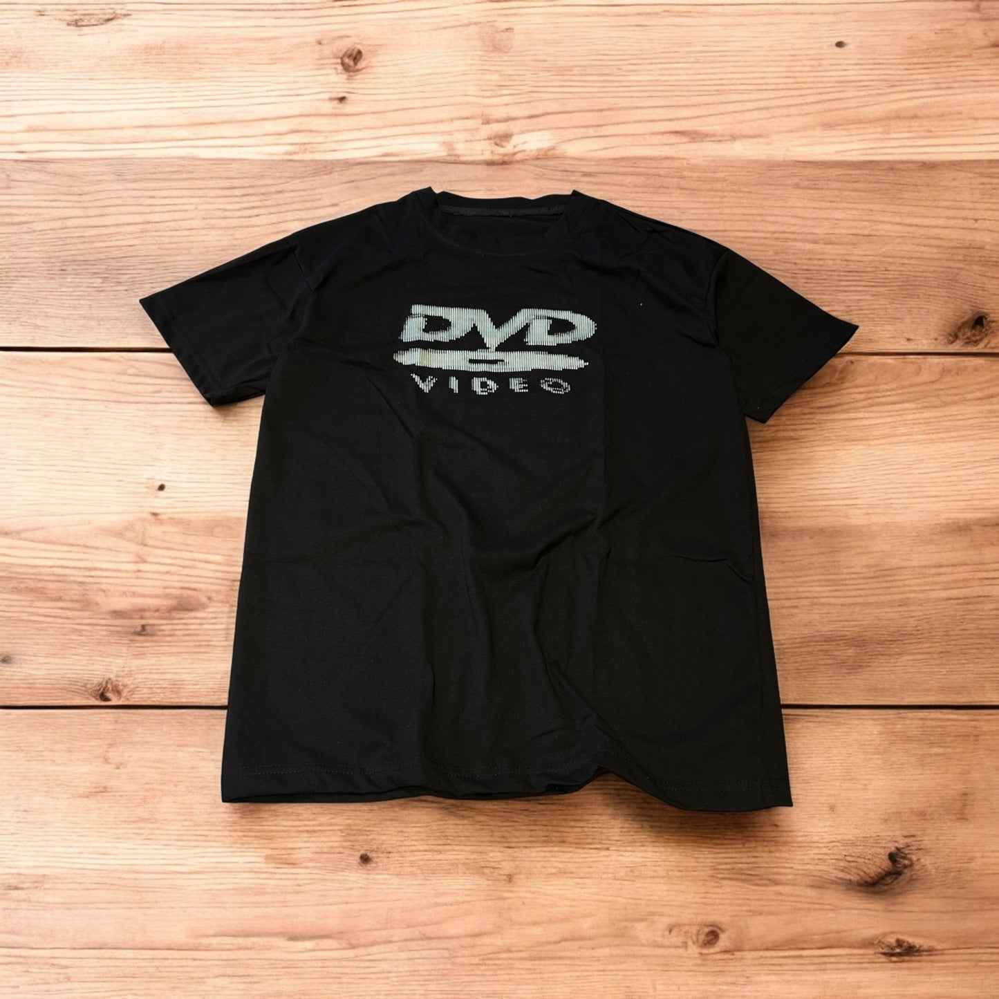 Vintage style old school DVD Video T-shirt with front graphic in black.