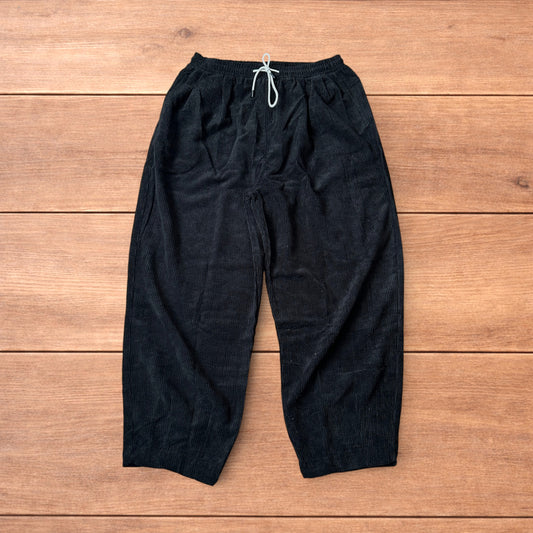 Super baggy wide leg skater corduroy trousers in black.