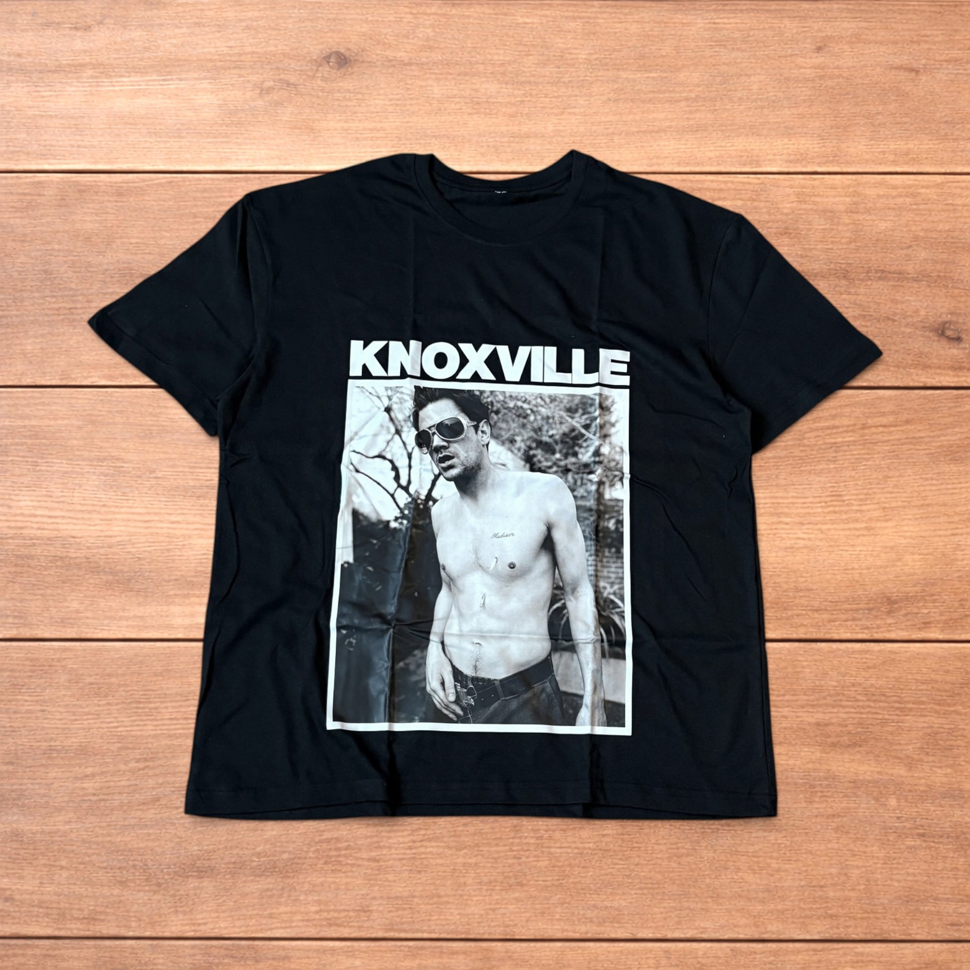 Black Jackass Knoxville t-shirt with large rectangular black and white graphic front print showing shirtless man with sunglasses
