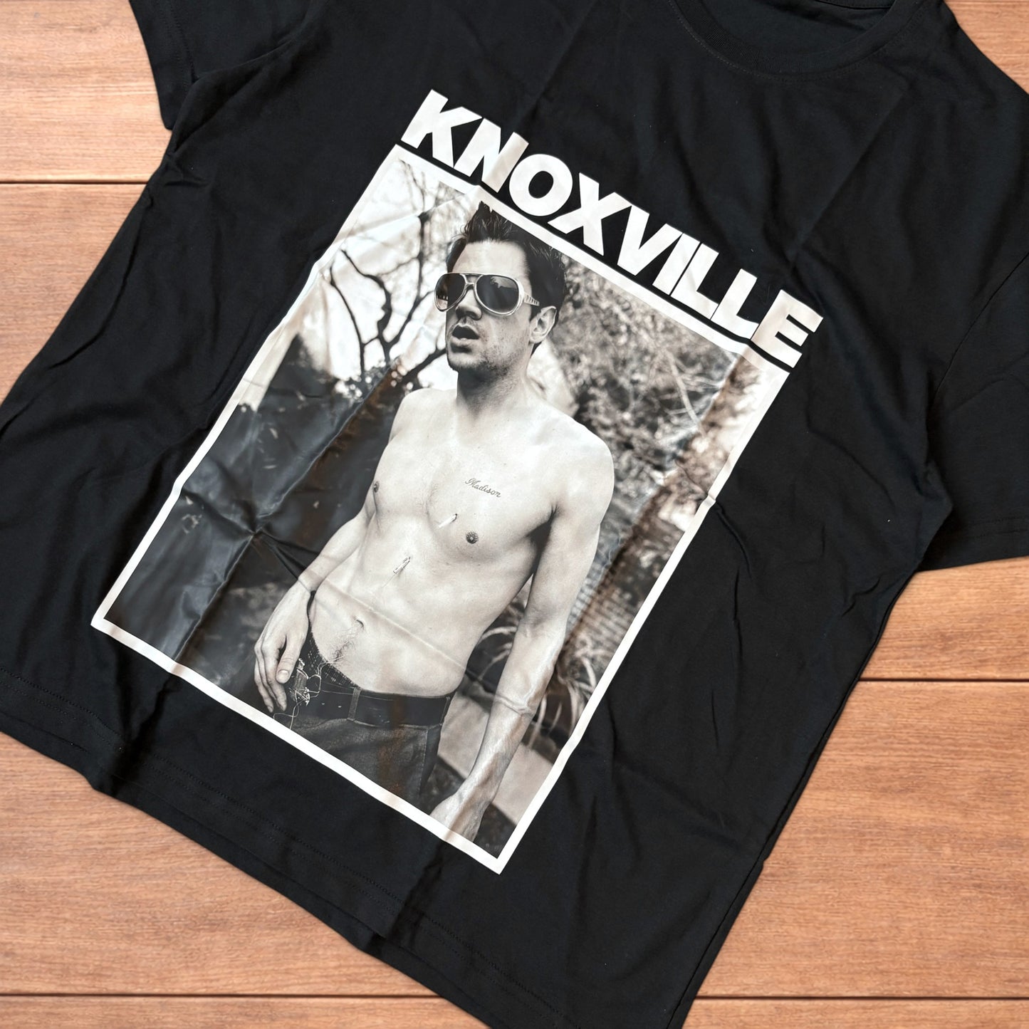 Black Jackass Knoxville t-shirt with large rectangular black and white graphic front print showing shirtless man with sunglasses