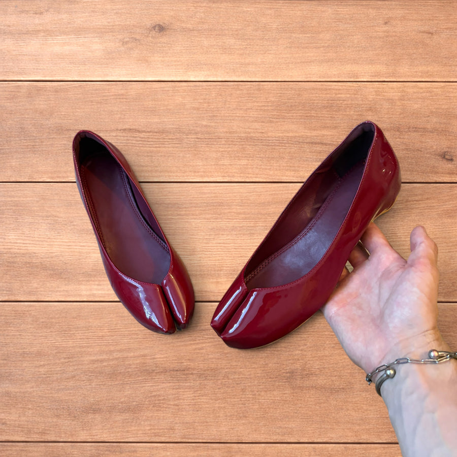 Red vintage style glossy faux leather tabi shoes with split toe and flat sole