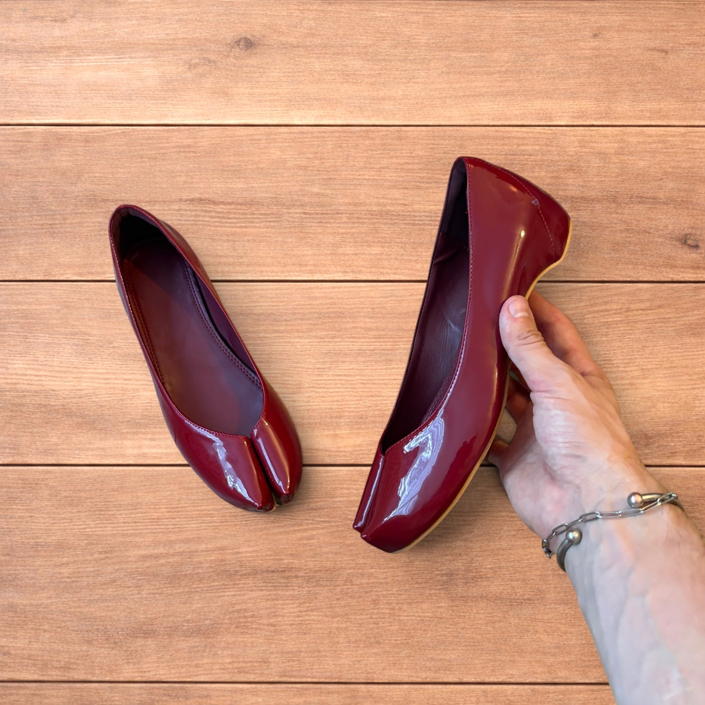 Red vintage style glossy faux leather tabi shoes with split toe and flat sole