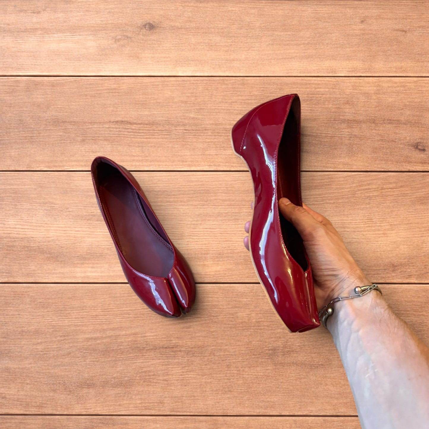 Red vintage style glossy faux leather tabi shoes with split toe and flat sole