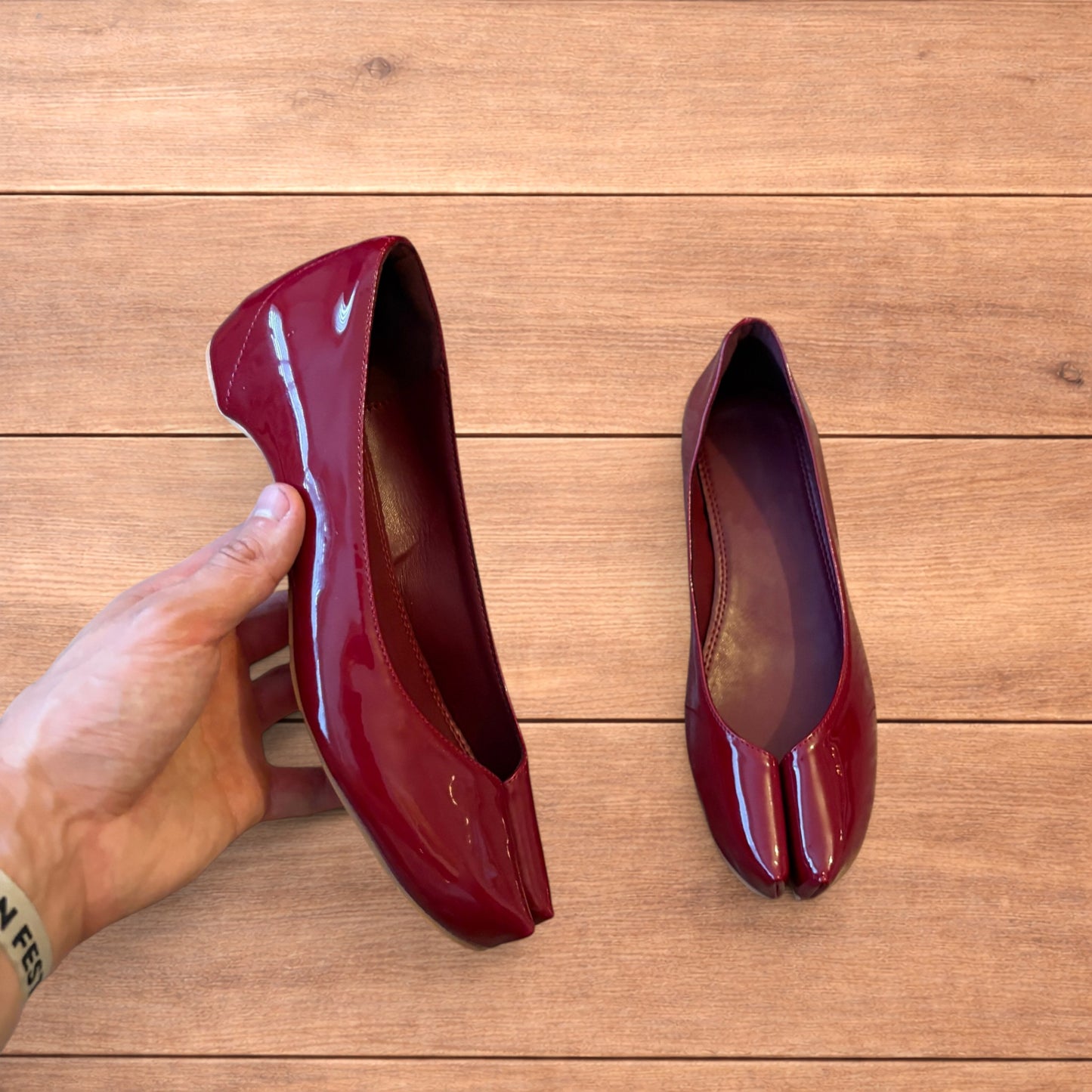 Red vintage style glossy faux leather tabi shoes with split toe and flat sole