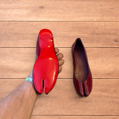 Red vintage style glossy faux leather tabi shoes with split toe and flat sole