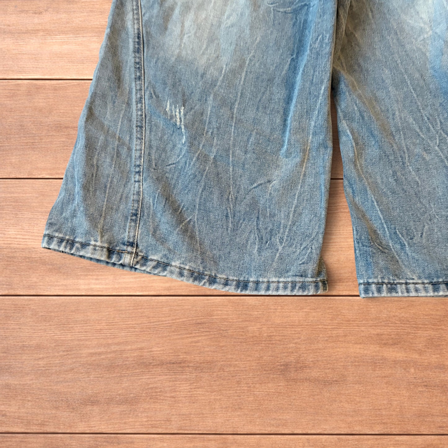 Light blue baggy wide leg denim shorts jorts with faded wash and elasticated back waistband