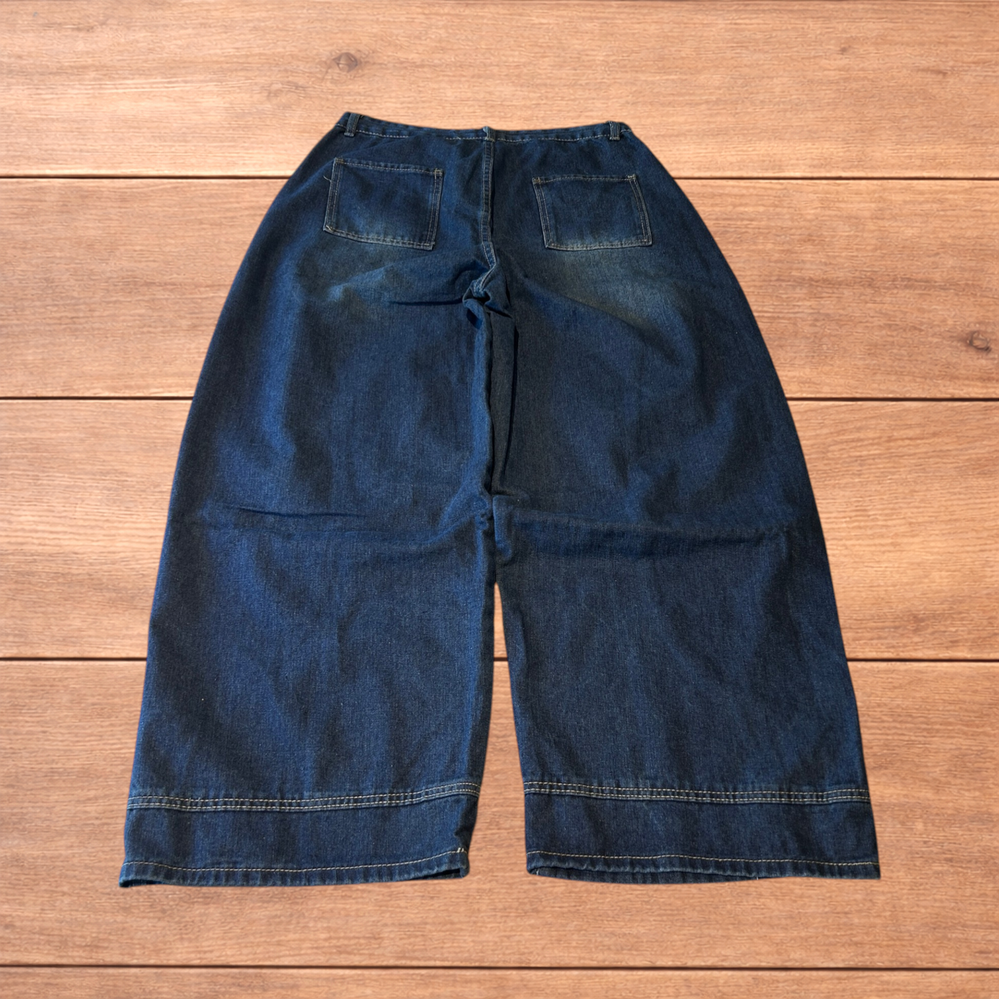 Incredible vintage style baggy wide leg skater fit jeans with fade in dark blue.