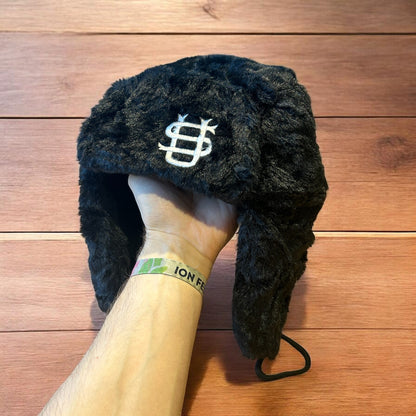 Russian ushanka trapper ear flap winter hat in black colour way.