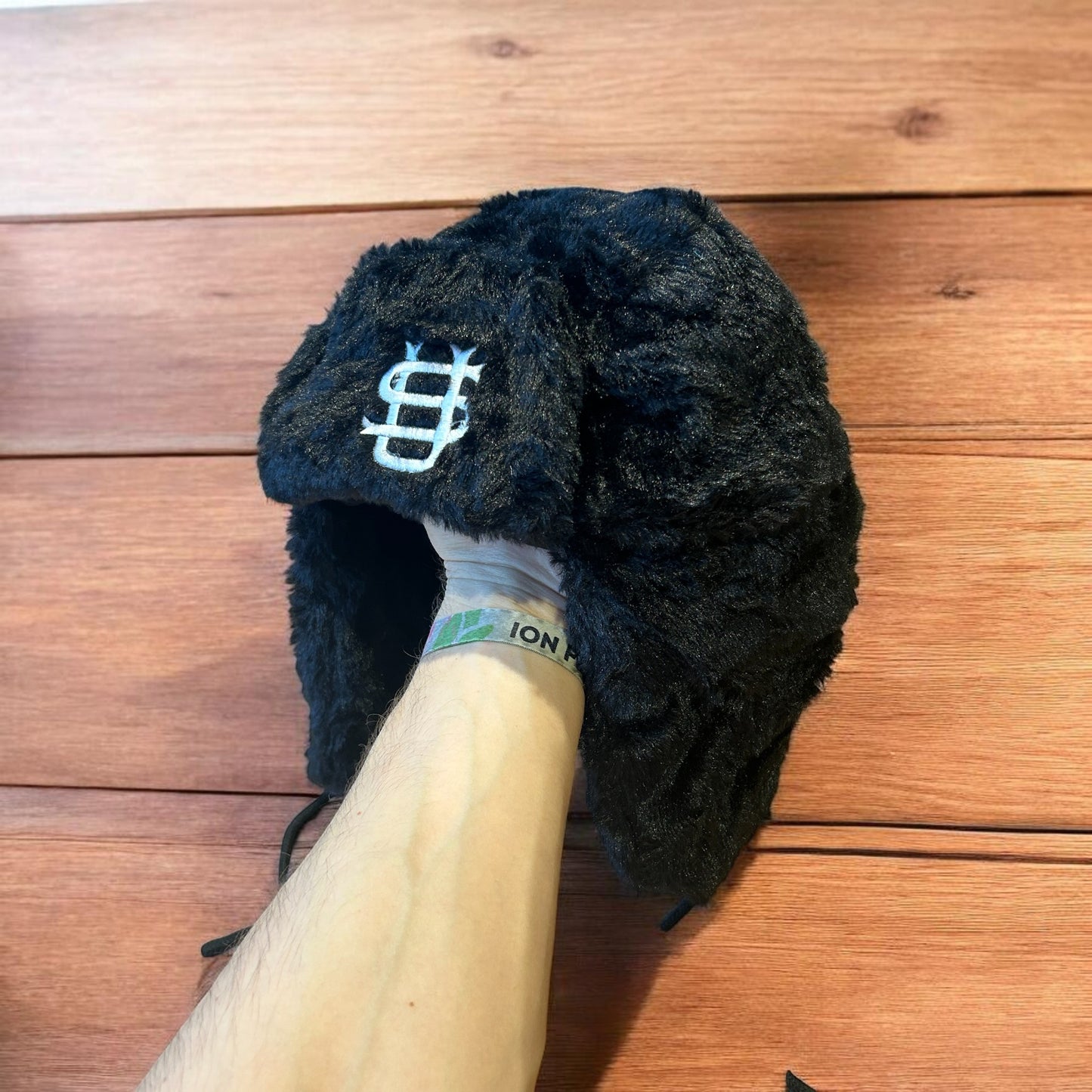 Russian ushanka trapper ear flap winter hat in black colour way.