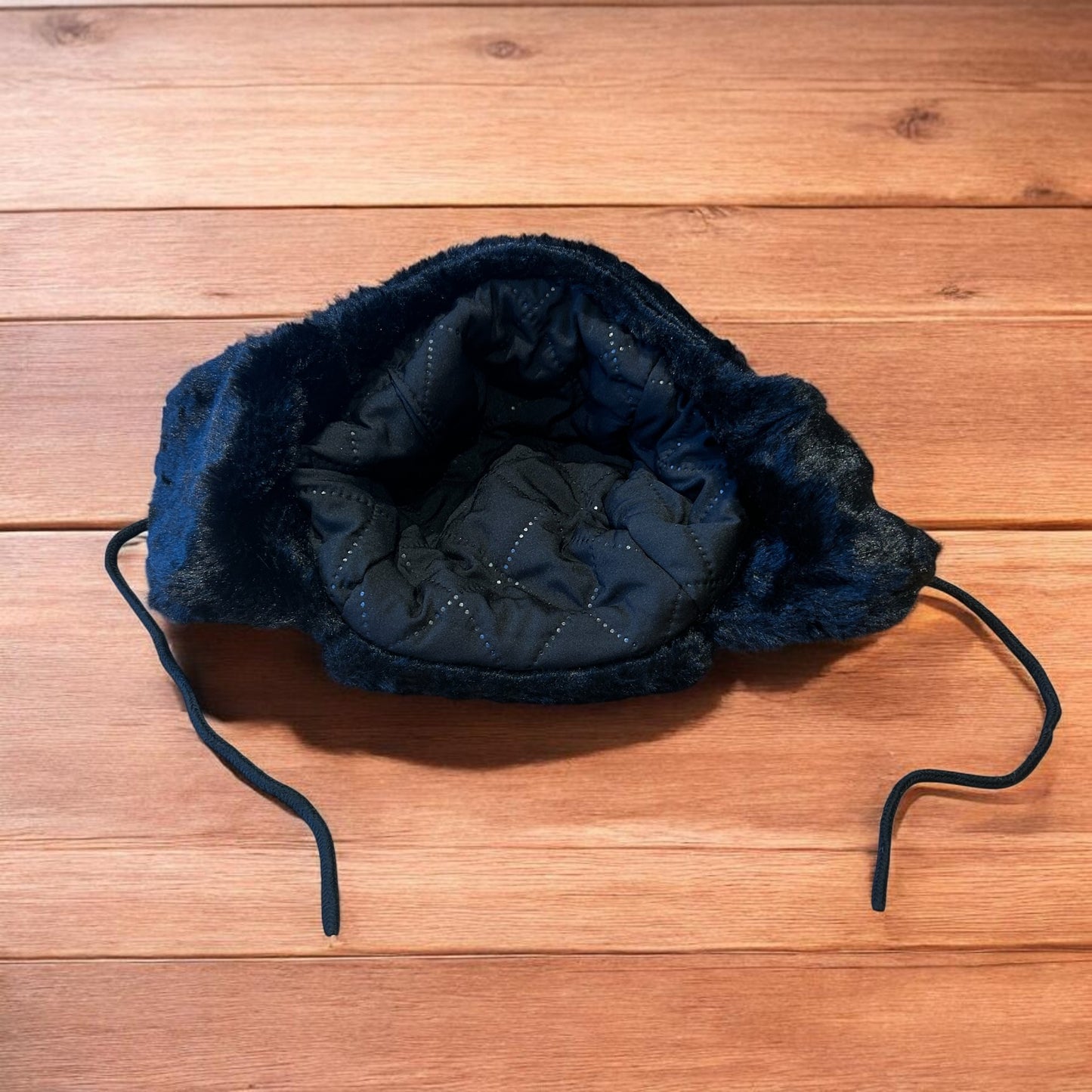 Russian ushanka trapper ear flap winter hat in black colour way.